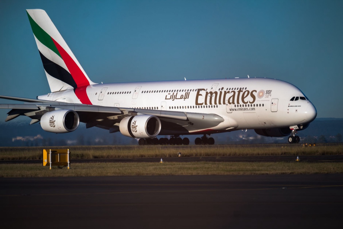 Dubai International Airport statistics board with passenger and cargo numbers