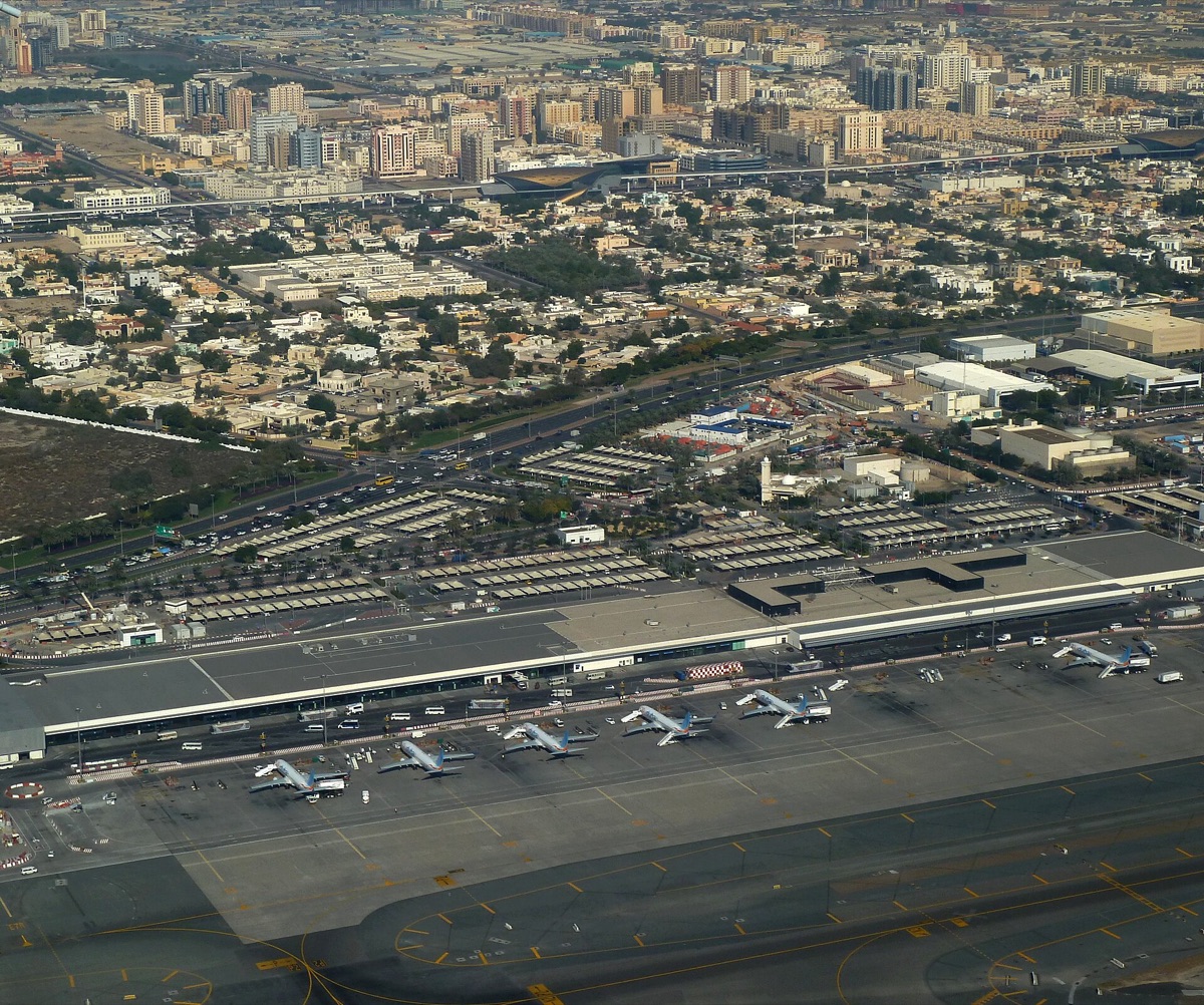 Dubai airport terminal with travelers and luggage