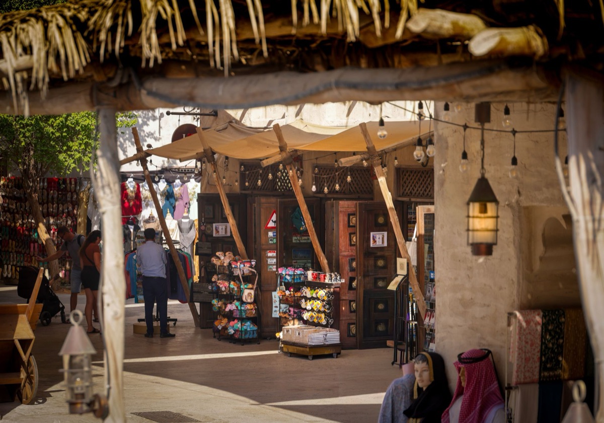 Entrance of Dubai Souk with traditional architecture and colorful stalls
