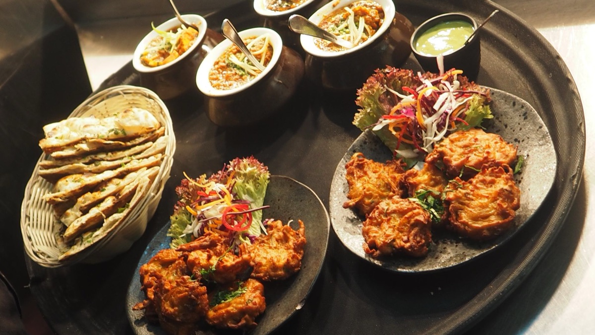Indian restaurant with colorful spices and curries