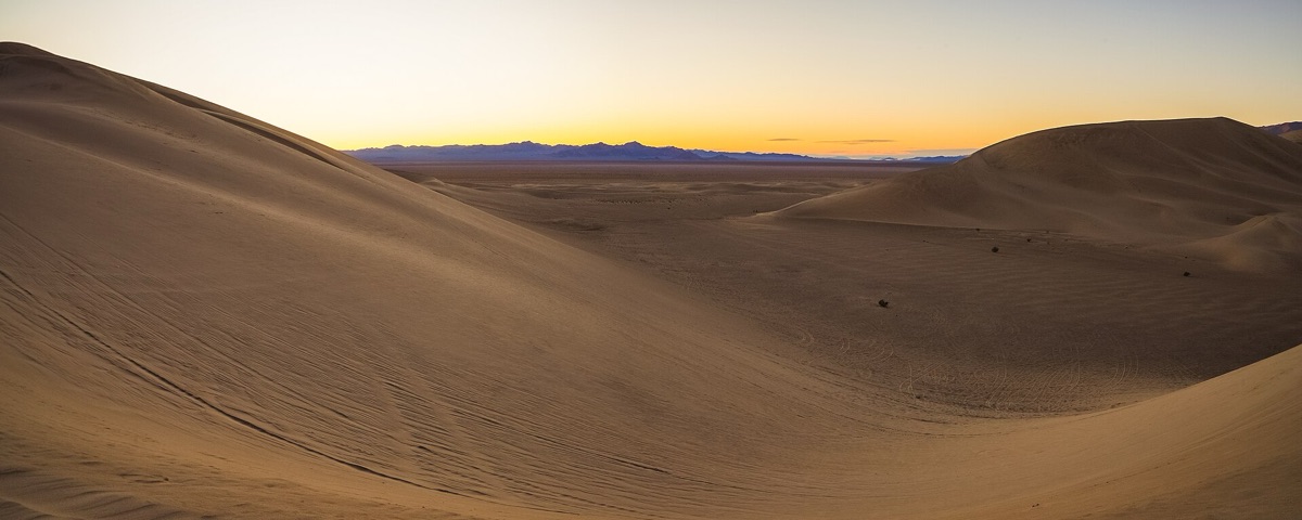 Sunrise over golden desert dunes near Dubai