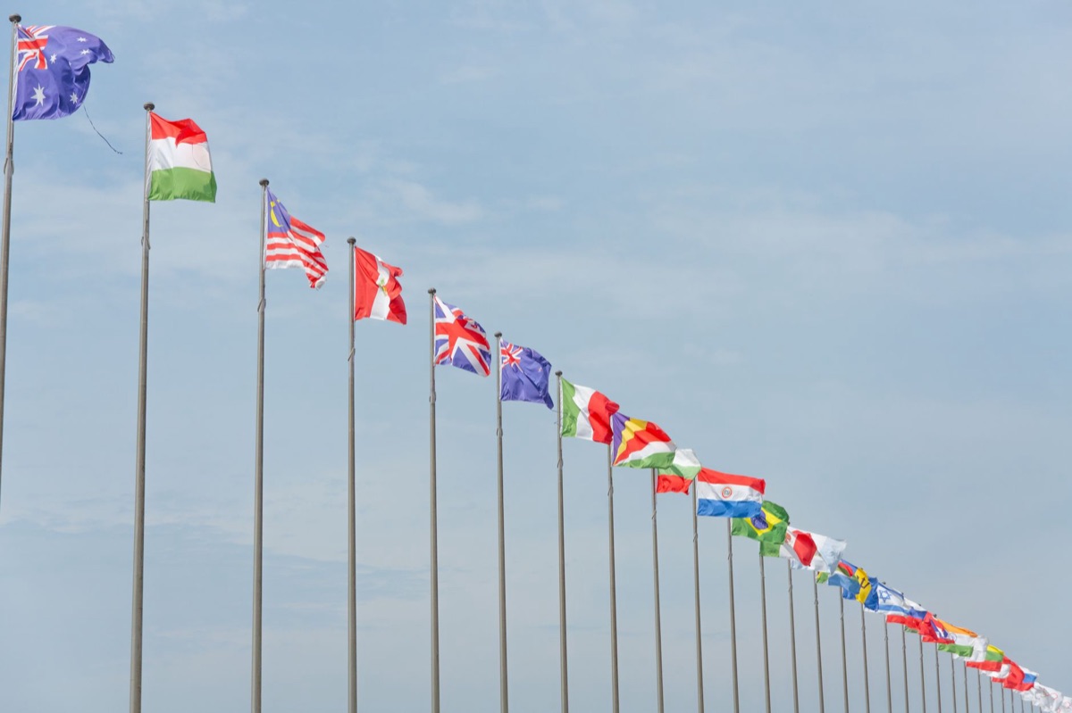 Dubai skyline with international flag poles
