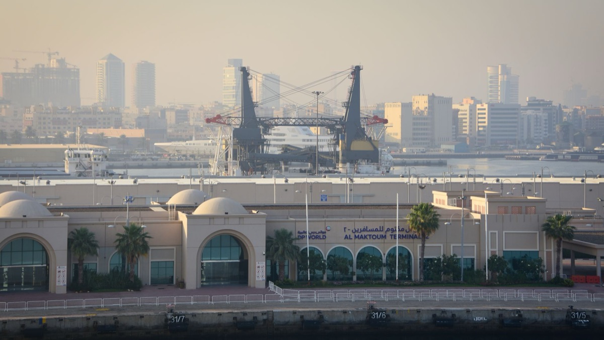18th century Dubai trade port with boats and cargo